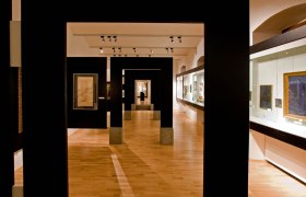 Interior view of the St. P&ouml;lten City Museum with exhibits and paintings.