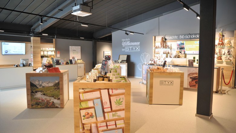 Interior view of the Styx Welcome Center with cosmetics and chocolate products.