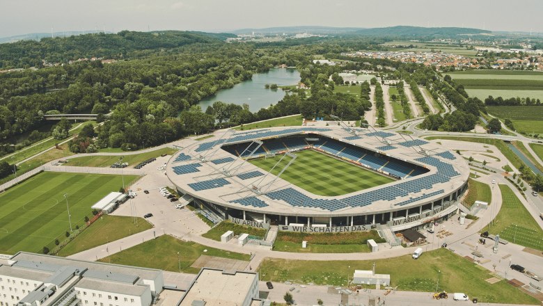 Aerial view of the NV Arena in St. P&ouml;lten, surrounded by green countryside and a river.