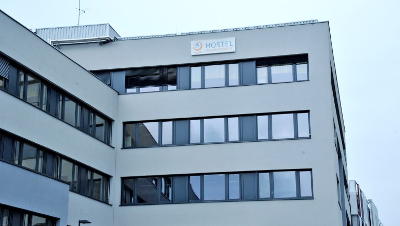 Modern building with 'Hostel Jugendherberge' sign.